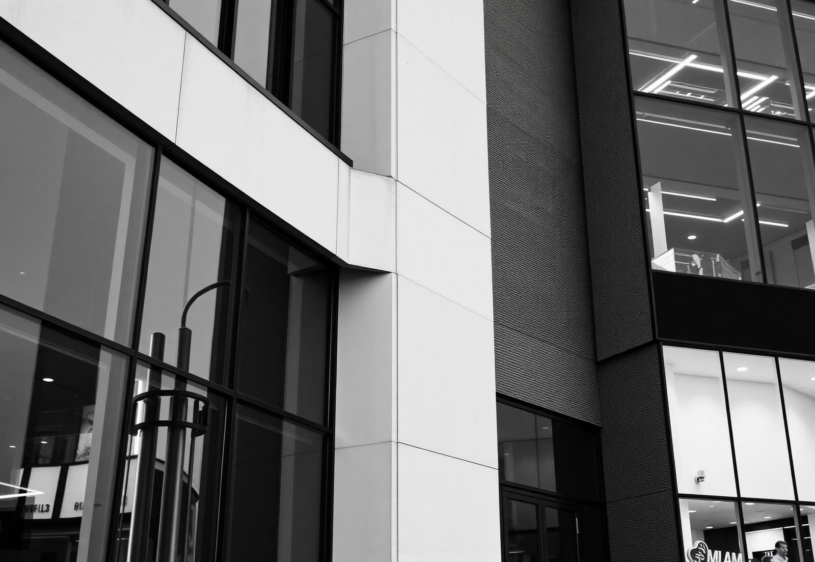 Modern commercial building facade in glass and stone